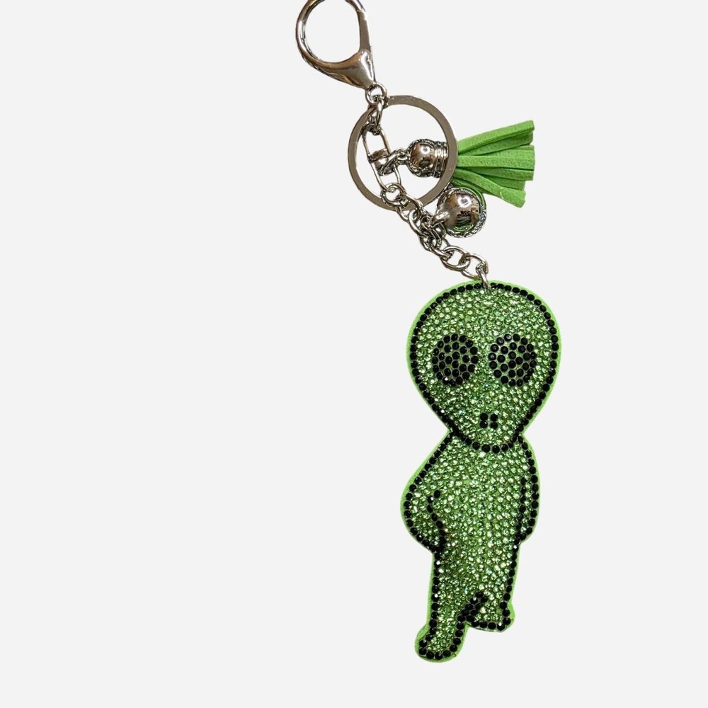 Green alien keychain with rhinestone details